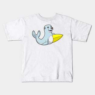 Seal at Surfing with Surfboard Kids T-Shirt